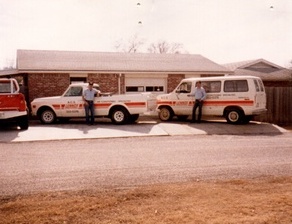 Old photo of Farris Heating trucks