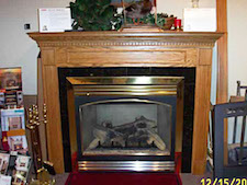 rich wood surround mantel fireplace