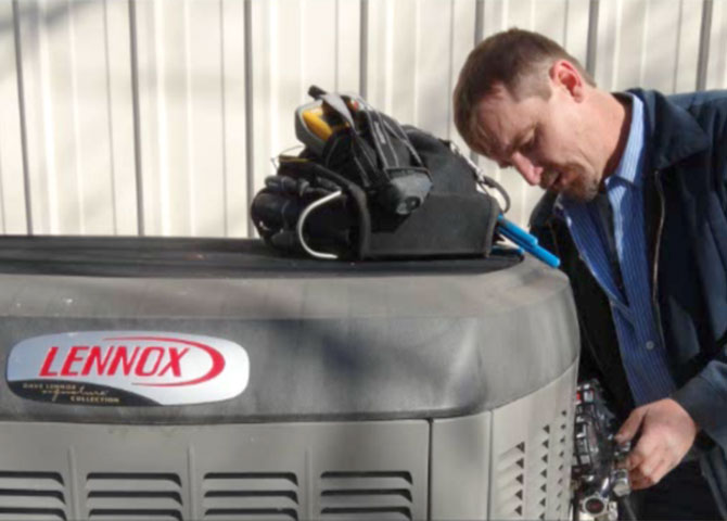 dave-crop Dave working on an air conditioner